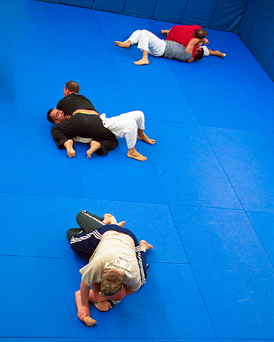 Jūjutsuka practicing grappling techniques at Boston Ketsugō Academy of Self Defense.